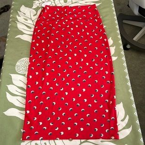 Fighting Eel skirt 95% Modal 5% Spandex. Red with white and black circle print.